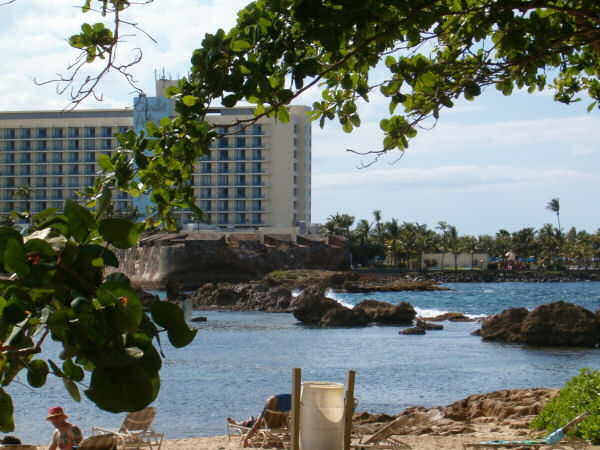 Beach, protected by rocks.