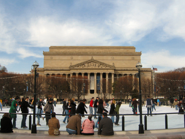 Ice skating ring with the National Archives in the background.